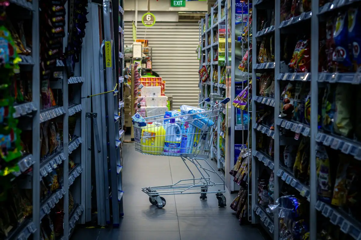 Shopping cart in a grocery store aisle